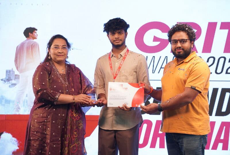 Receiving the GRIT Award for Open Source Contribution on stage